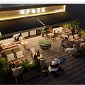 Commercial Street Outdoor Dining Space With Greenery Panda Crane Decor Cozy Seating And Ambient Lights