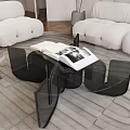 Modern White Sofa And Black Coffee Table Set With Open Book On Gray Rug