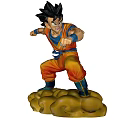Goku Dragon Ball Anime Character in Orange Martial Arts Uniform Fighting Stance on Cloud Base