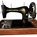 Vintage Industrial Sewing Machine Featuring Black Metal Components Wooden Base And Golden Decorative Patterns