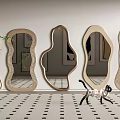 Various Shaped Wooden Mirrors Wall Mounted in Modern Interior With Patterned Floor and Decorative Cat