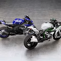 Two Sporty Green White And Blue Motorcycles On Gray Floor With Gray Walls