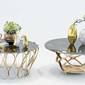 Modern Round Coffee Tables With Black Marble Top And Golden Artistic Base Decorative Vases Books And Greenery