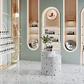 Modern Boutique Interior Design With Circular Mirrors Gold Display Shelves Marble Counter And Terrazzo Floor