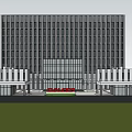 Modern Office Building With Glass Curtain Wall Surrounded By Lawn And People Walking