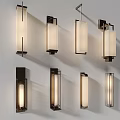 Contemporary Wall Sconces With Multiple Designs Illuminating White Wall In Stylish Home Decor
