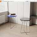 Modern Round Stools With Blue And Black Tops And Metal Frames In Room Corner