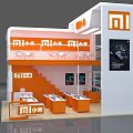 Two Story Orange and White MI Exhibition Booth With Display Cabinets Staircase and Plants