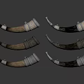 Vintage Decorative Horns With Silver Metal Accents Arranged On Black Reflective Background
