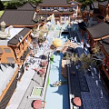 Traditional Chinese Garden Landscape With Water Pathways Decorative Lanterns And Courtyard Greenery
