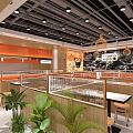 Modern Shopping Mall Restaurant With Orange Counter Wooden Elements Tables Chairs And Green Plants