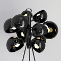 Modern Multi Head Floor Lamp With Black Metallic Shades And Lit Bulbs