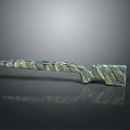Green and black marbled rifle with mineral texture on smooth black surface showing modern appearance