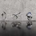 Modern Abstract Metallic Sculptures With Curved Geometric Design And Reflective Surface