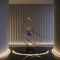 Contemporary Metallic Sculpture With Circular Rings Central Blue Sphere On Black Base And Modern Lighting