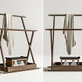 Natural Wooden Clothing Rack With X Shaped Frame Bottom Tray Decorative Stones And Light Towel