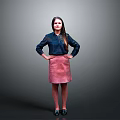 Woman In Blue Shirt And Pink Skirt Standing With Hands On Hips Against Gray Background