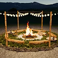 Burning Bonfire At Night With Stone Circle Wooden Posts String Lights And Mountain Background 3d model