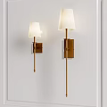 Modern Wall Lamps With White Fabric Shades And Brass Finish Mounted On White Wall