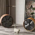 Two Brown Air Cooler Fans With White Cat Figurine And Green Plant In Interior Room