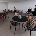 Modern Cafe Interior Featuring Black Tables And Red Chair Sets For Customers 3d model