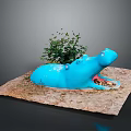 Blue Hippo Sculpture With Small Plant On Sandy Ground Decorative Artwork
