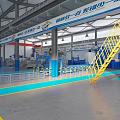 Industrial Factory Interior With Red Overhead Cranes Blue Floor Markings Equipment And Signage