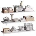 Organized Bathroom Accessories On White Shelves With Wicker Wire Baskets And Folded Towels