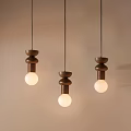 Three Wooden Pendant Lights With Minimalist Design And Illuminated Bulbs In Modern Interior