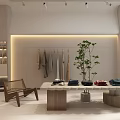 Modern Bright Clothing Store Interior With Clothes Racks Green Plants Display Table And Staircase