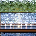 Blue Mosaic Tile Feature Wall With Front Fountains And Green Trees Background