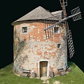 Old Brick Windmill Tower With Weathered Walls Wooden Blades And Grass Area
