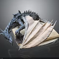Artistic Dragon Character Sculpture With Detailed Textured Wings Lying On Book Platform