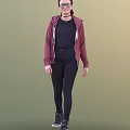 A woman wearing maroon hoodie black T-shirt black leggings and black shoes on green background