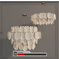 White Leaf Shaped Chandeliers with Golden Metal Frames Against Gray Wall Interior Design