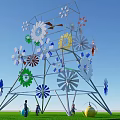 Scenic Metal Art Installation With Colorful Flowers And People On Green Grass Under Blue Sky