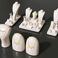 Elegant Jewelry Display with White Mannequins Necklaces and Earrings on Stands