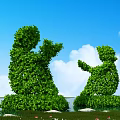 Human Shaped Topiary Shrub Sculptures on Grassland with Blue Sky White Clouds and Red Flowers