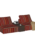 Stylish Two Seater Sofa With Striped Patterned Cushions Side Table And Golden Blanket