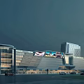 Modern Commercial Complex With Glass Facade Large LED Screen And Night Lighting
