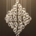Modern Elegant Chandelier with Transparent Glass Balls Hanging Under Light Glow