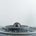 Tranquil Courtyard Garden Featuring Ornamental Spherical Ball Fountain With Flowing Water And Lush Greenery