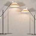 Two Modern Floor Lamps With Curved Metal Stands And Light Colored Shades For Home Decor