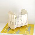 White Wooden Baby Crib With Carved Headboard And Wheels On Yellow Rug With Gray Patterns