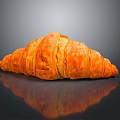 Freshly Baked Croissant With Golden Brown Flaky Layers On Black Surface With Reflection