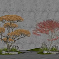 Two Trees With Yellow And Red Leaves Surrounded By Stones Green Grass Against Gray Wall