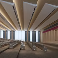 Spacious Conference Room With Wooden Linear Ceiling Rows of Seats Large Windows Stage Area