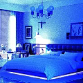 Modern Bedroom Interior With Large Bed Chandelier Table Lamp And Framed Art