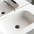 Sleek Modern Bathroom Washbasin Design With Countertop Faucet And Cabinet Lighting