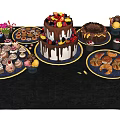 Assorted Dessert Display With Multi Layer Cake Donuts Cupcakes Cookies And Chocolates